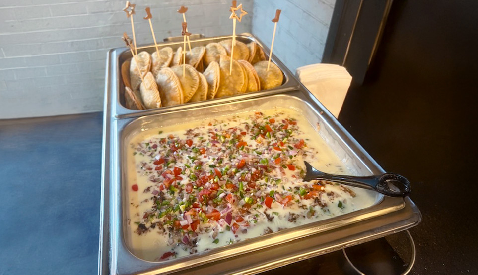 Crossbuck BBQ Queso and Empanadas at a catering event